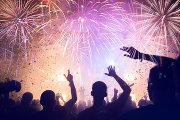 Crowd with Fireworks. New Years Eve concept.
