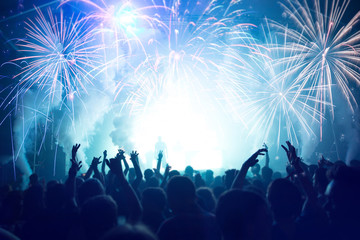 Crowd with Fireworks. New Years Eve concept.