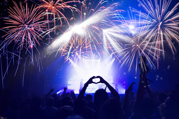 Crowd with Fireworks. New Years Eve concept.