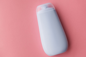 Bottle of shower gel on pink background.selective focus