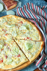 Slice of hot pizza large cheese lunch or dinner crust seafood meat topping sauce. with bell pepper...