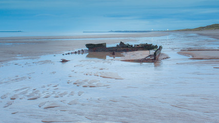 Fototapeta na wymiar The wreck of the cargo ship Hanseat on Warkworth Beach. Northumberland. England. UK