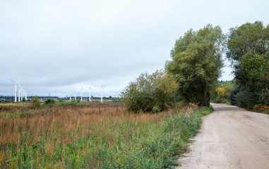 Fototapeta na wymiar modern windmills in the field