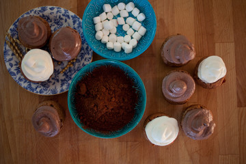 The process of making chocolate cupcakes with marshmallows