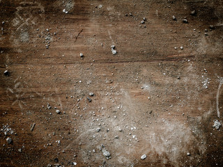 Concrete dust on wood.