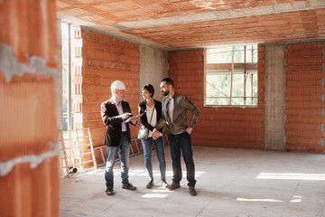 Realtor Showing New Home To Happy Married Couple