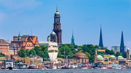Hamburg Harbor, Germany. Cityscape with the pier Landungsbruecken and the church tower of St. Michael's Church (St. Michaelis). © foto-select