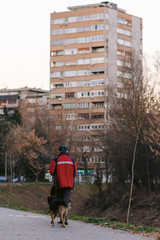 man walking dog in park