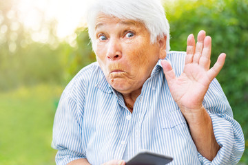 old woman talking on the phone, smartphone, smiling, call children