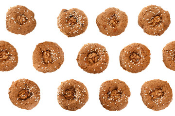 Homemade oatmeal cookies with nuts and sesame. View from above. Isolated on white background.. Seamless pattern.