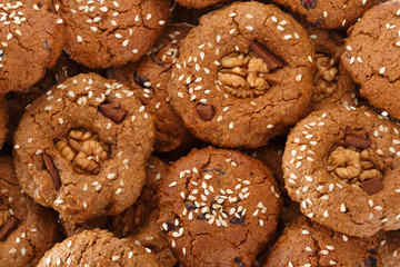 Homemade oatmeal cookies with nuts, chocolate chips and sesame. View from above.