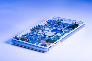 Repairing the smartphone's motherboard in the lab. the concept of computer hardware, mobile phone,...