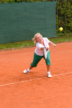 Senior Woman Playing Tennis