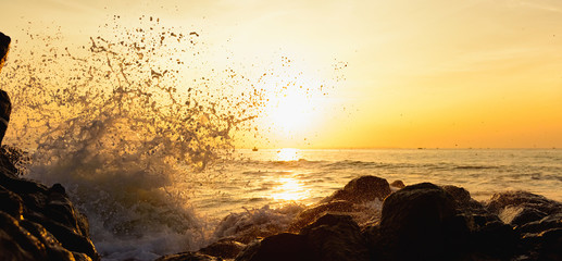 sunset splashing waves