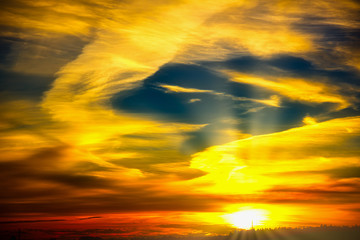 Fototapeta na wymiar Sunset in clouds colorful