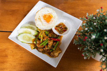 Stir Fried Crispy Pork with rice and fried egg