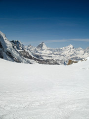 Fototapeta na wymiar the Monte Rosa mountain range and Matterhorn mountain peak in the Swiss Alps above Zermatt in winter