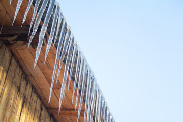 Icicles at wooden roof