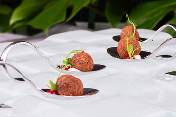 Balls from a cauliflower with crackers with greens