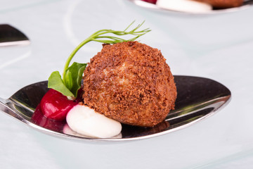 A caramelized ball with cream creamy and berry mousse