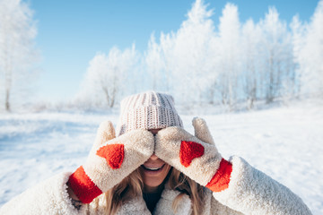 Woman in gloves in magic winter day