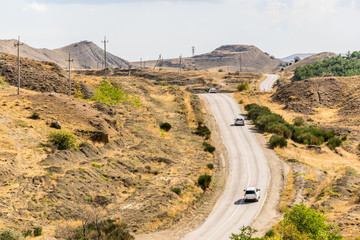 Highway  in the steppe among the hills