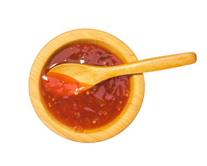 Red hot chilli pepper sauce  in wooden bowl isolated on white background.