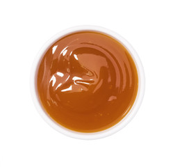 Chinese sauce, Sweet and sour sauce in ceramic bowl isolated on a white background.Top view