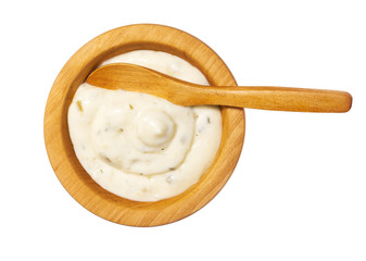 Tartar sauce in wooden bowl isolated on white background.Top view