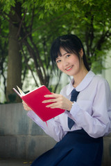 asia thai high school student uniform beautiful girl read a book