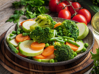 Mix of boiled vegetables, steam vegetables for dietary low-calorie diet. Broccoli, carrots, cauliflower, side view.
