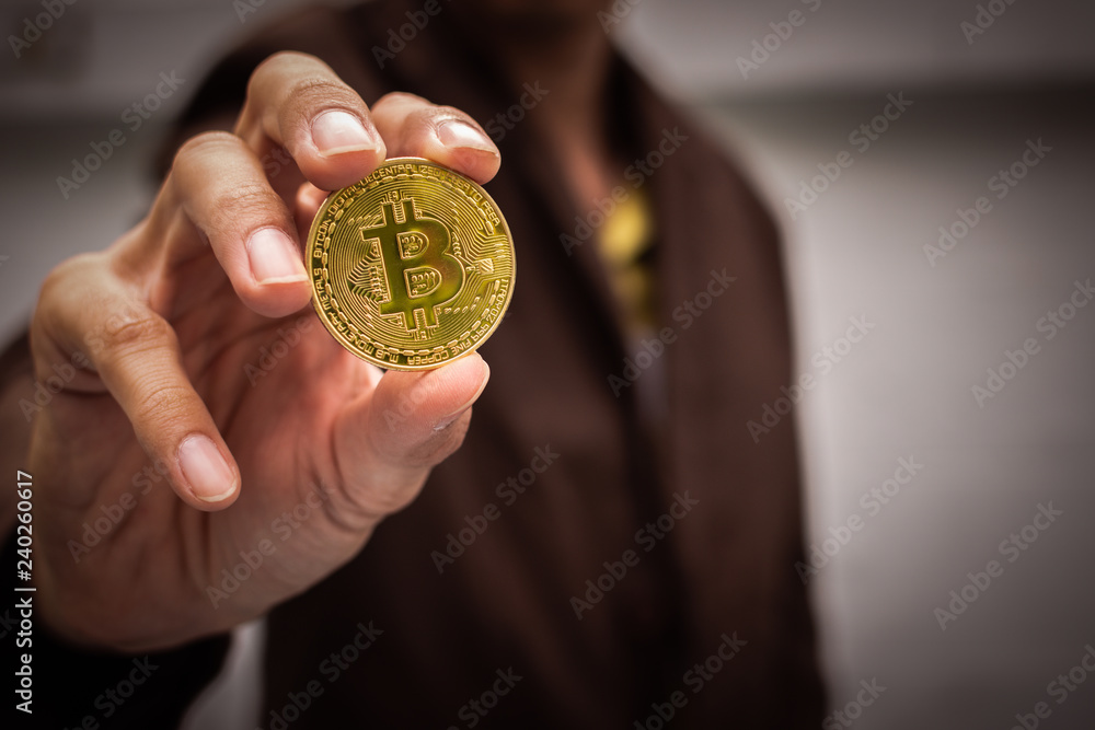 Poster businessman holding cryptocurrency bitcoin. digital money for banking and international network paym
