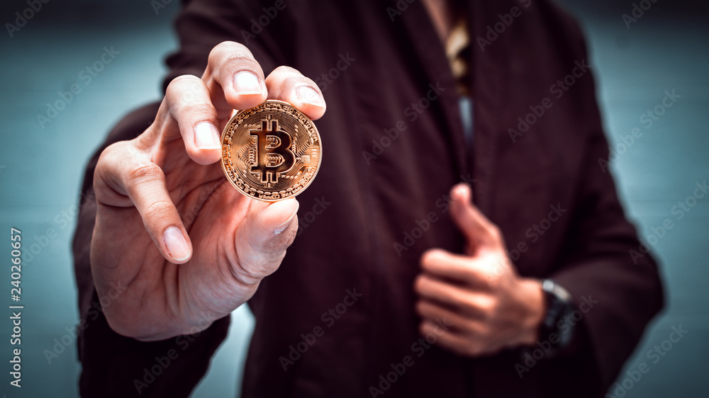 Poster businessman holding cryptocurrency bitcoin. digital money for banking and international network paym
