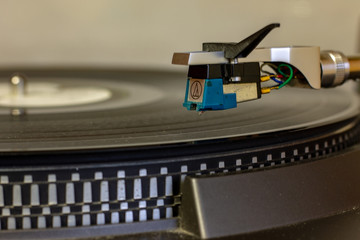 An old record player that still works and can read music from vinyl records. Famous its operation...
