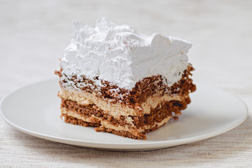 Tiramisu cake with walnuts on a plate
