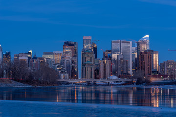 Calgary's skyline along the Bow River in winter.