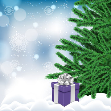 blue gift box in a snowdrift under the tree