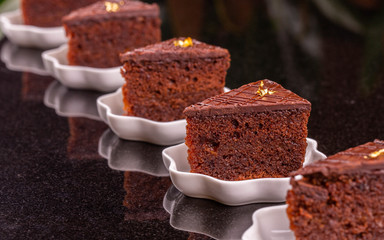 The chocolate biscuit soaked with cognac with chocolate