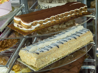 Several Types of Stuffed Cakes inside a Pastry Display Stand