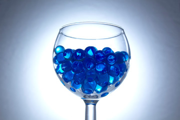 Blue hydrogel balls in a glass	
