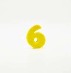 Yellow number six on white background - 240269432