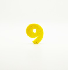 Yellow number nine on white background - 240269444