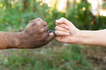 close up man and woman hands touching holding together on blurred background for love valentine day concept, shake hand with a dirty hand and a clean, Stained,