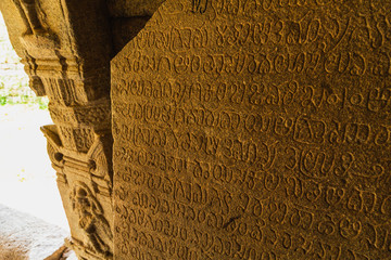 Old inscription on a ancient temple in Hampi, India