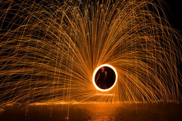 steel wool or cast fire orange light in the water.
