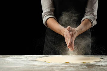 Cookery.Chef prepares dough for pasta, pizza, bread.Preparation and work with flour. Delicious...
