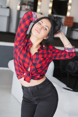 Thoughtful woman posing in a studio