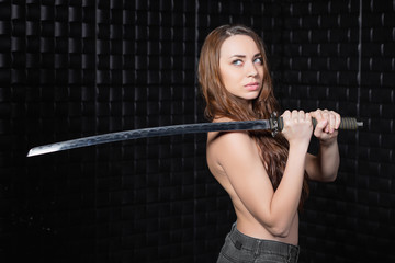 Thoughtful woman with a katana