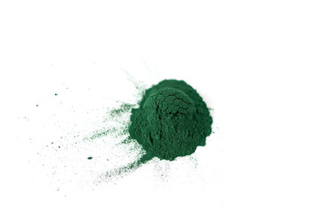 Spirulina / chlorella powder close-up, top view, isolated on white background