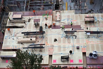 Aerial view of men and materials during the construction of a 42-story high-rise apartment building in midtown Manhattan, New York City.